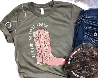 Womens This Ain't My First Rodeo Graphic Tee | Country Shirt | Rodeo Graphic Tee | Southern Shirt | Western Style Shirt | Cowgirl Shirt