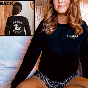 May include: Black long-sleeved sweatshirt with the text "FLOAT nurse" on the front and a unicorn float with the text "FLOAT NURSE" on the back.