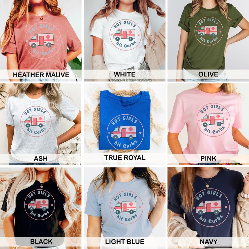 May include: A collection of t-shirts in various colours featuring a graphic of a cartoon ambulance with the text "Hot Girls Hit Curbs".