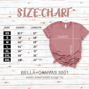 May include: Size chart for a unisex jersey short sleeve tee, showing chest and length measurements in inches for sizes XS to 3XL. The chart is printed on a light wood background.