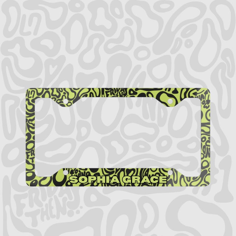 Green and black f1 themed lando norris car license plate frame is shown against a black and white lando norris pattern. With personalised name engraved on the print. 

Lando Norris F1 License Plate Frame: Green and black pattern, Aluminum