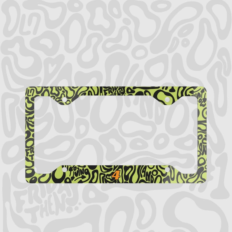 Green and black f1 themed lando norris car license plate frame is shown against a black and white lando norris pattern. Personalised racing number 4 is on the bottom of the frame in orange and black text outline. 

Lando Norris F1 License Plate Frame: Green and black pattern, Aluminum
