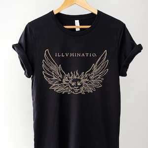 May include: Black t-shirt with a gold graphic of a face with wings and the text "ILLVMINATIO."