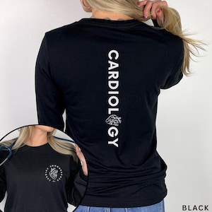 May include: A black long-sleeve shirt featuring white text on the back that reads CARDIOLOGY with a small anatomical heart graphic. The front chest area displays a circular logo with the text CARDIAC SONOGRAPHER and an anatomical heart.