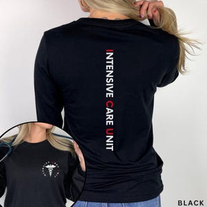 May include: Black long-sleeve shirt with the text "INTENSIVE CARE UNIT" in red and white vertically down the back. A smaller image shows a shirt with a medical symbol and the text "INTENSIVE CARE UNIT".
