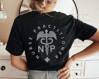 May include: Black t-shirt with a white graphic of a medical symbol and the text "NURSE PRACTITIONER NP".