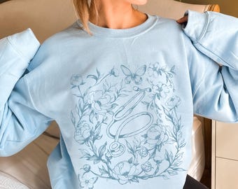 Sudadera de enfermera con flores, sudadera de enfermera titulada, regalo de graduación de enfermera, suéter de enfermera, regalos de enfermera, cuello redondo de enfermera, ropa de enfermera