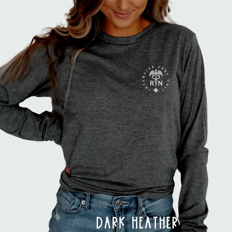 May include: A dark heather grey long-sleeve shirt with a white graphic of a medical symbol and the text "INTENSIVE CARE UNIT RN".