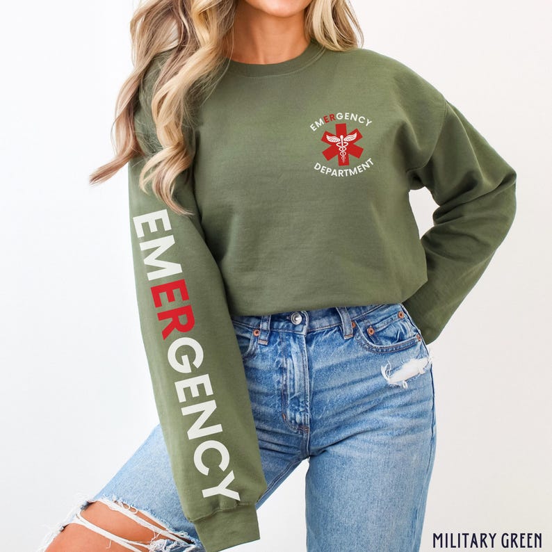 May include: A green sweatshirt with the text "EMERGENCY DEPARTMENT" and a red medical symbol on the front. The left sleeve has the word "EMERGENCY" written vertically in white and red letters.