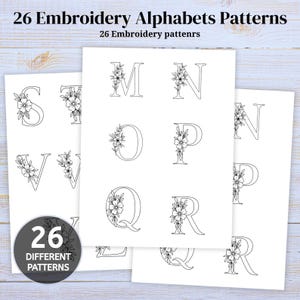 May include: A collection of white paper sheets featuring black line art of 26 embroidery alphabet patterns. Each letter is decorated with floral motifs. A circular badge in the bottom left corner displays the text 26 DIFFERENT PATTERNS.