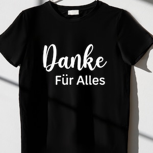May include: Black t-shirt with white text that says "Danke f&uuml;r Alles".