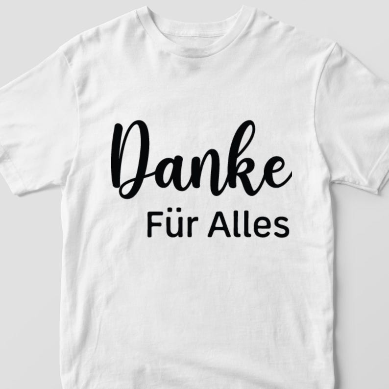 May include: White t-shirt with black text that says "Danke f&uuml;r Alles".
