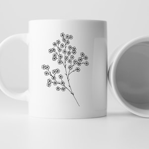 May include: White ceramic mug with a black line drawing of a sprig of small flowers.