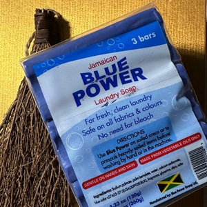 May include: A package of three blue bars of Jamaican Blue Power Laundry Soap. The packaging includes text that reads "For fresh, clean laundry, Safe on all fabrics & colours, No need for bleach." The total weight is 12.69 oz (360g).