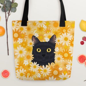 猫のトートバッグ、デイジーのトートバッグ、ショッピングバッグ、花柄のトートバッグ、猫好きの方へのギフト、トレンディなトートバッグ、再利用可能なバッグ、黒猫のアートプリント