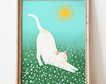 May include: A framed art print featuring a white cat stretching in a field of white flowers and green grass under a yellow sun against a blue sky. The artwork is in a wooden frame.