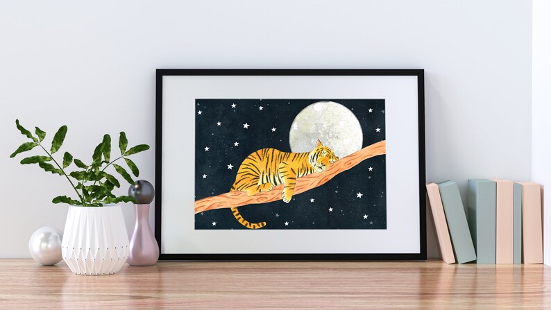 May include: A watercolor painting of an orange and black tiger sleeping on a branch under a full moon with a starry night sky background.