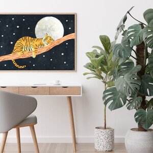 May include: A framed illustration of an orange tiger sleeping on a branch with a full moon and stars in the background.