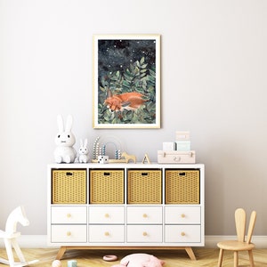 May include: A white dresser with wicker baskets and drawers, a rocking horse, a small white rabbit, a larger white rabbit, and a framed print of a fox sleeping in a forest with a starry night sky.