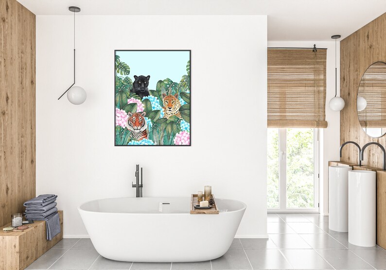 May include: A framed illustration of three wild cats, a black panther, a tiger, and a leopard, peeking out from behind lush green leaves and pink hydrangeas.
