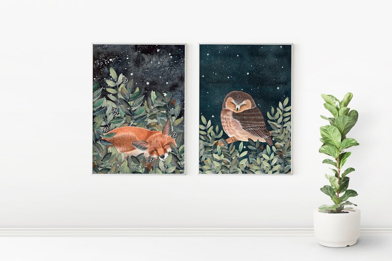 May include: Two framed watercolor illustrations of a sleeping fox and an owl in a forest setting against a dark blue starry night sky.