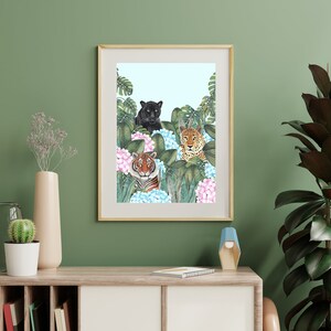 May include: A framed print of a black panther, a tiger, and a leopard in a jungle setting with pink and blue flowers.