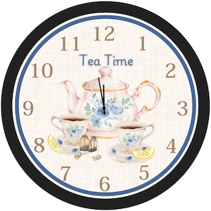May include: Round wall clock with a tea theme. The clock face features a pink teapot, two teacups, and the words "Tea Time." The clock hands point to 12 o'clock. The clock has a black and blue border.