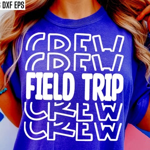 May include: A purple t-shirt with white text that reads "Crew Field Trip Crew" in a layered, stacked design.