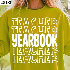 May include: A yellow t-shirt with the text "TEACHER YEARBOOK TEACHER" in white outlined letters.