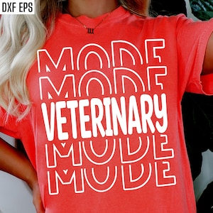 May include: A red t-shirt with the text "MODE VETERINARY MODE" in white outlined letters.
