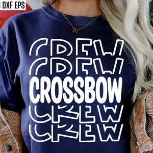 May include: A navy blue t-shirt with white text that reads "CREW CROSSBOW CREW". The text is stacked vertically with the word "CROSSBOW" in the center.