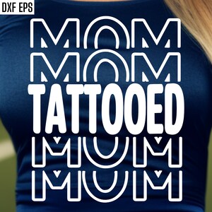May include: A navy blue t-shirt with white text that reads "MOM MOM TATTOOED MUM MUM".