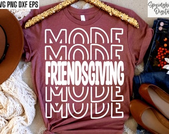 May include: A maroon t-shirt with the text "MODE FRIENDS GIVING MODE" in white outlined letters.