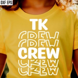 May include: A yellow t-shirt with the text "TK CREW" in white letters. The text is repeated multiple times in a layered effect.