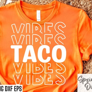 May include: Orange t-shirt with white text that reads "Taco Vibes" in a retro font.