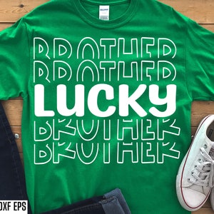 Pode incluir: Camiseta verde com texto branco que diz "Drafted Lucky Brother" em uma fonte de estilo retrô.