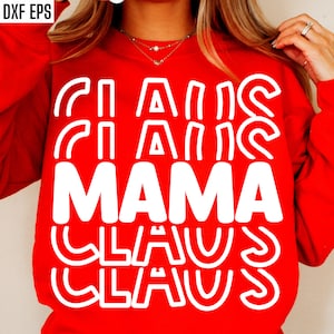 Könnte beinhalten: Roter Pullover mit weißem Text, der "Mama Claus" in einem geschichteten, gestapelten Schriftstil lautet.