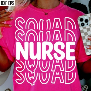 May include: Pink t-shirt with white text that says "Nurse Squad" in a wavy, layered font.