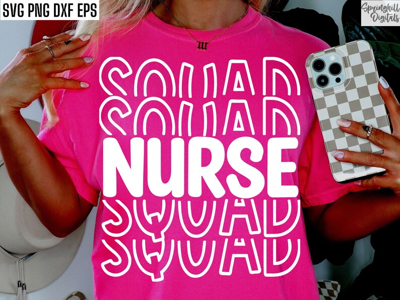 May include: Pink t-shirt with white text that says "Nurse Squad" in a wavy, layered font.
