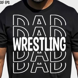Peut inclure: T-shirt noir avec un motif graphique blanc qui dit "DAD WRESTLING DAD" dans une police superpos&eacute;e.