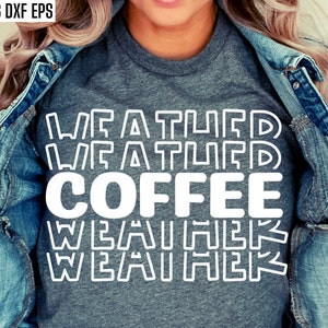 May include: A gray t-shirt with the text "WEATHER WEATHER COFFEE WEATHER WEATHER" in white outlined letters.