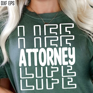May include: A green t-shirt with white text that reads "I need an attorney" with a graphic of a maze above and below the text.