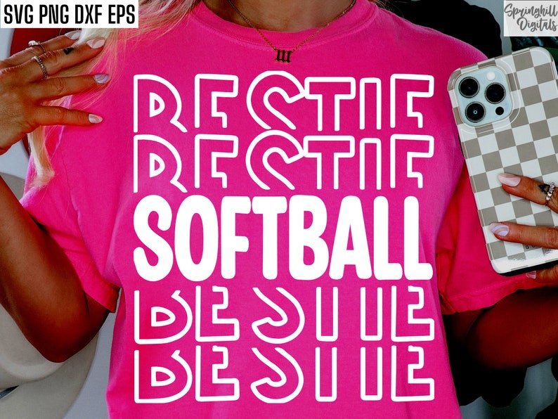 May include: A pink t-shirt with the words "Rectif Softball Besuile" in white outlined letters.