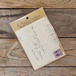 May include: A vintage envelope with a handwritten address to "Mr. and Mrs. Oscar Linden, Cand Family, Spring Green, Wisconsin". The envelope has a stamp with a portrait of George Washington and a canceled postmark from 1974.
