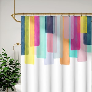 May include: A white shower curtain with a colorful abstract design of vertical rectangles in shades of blue, yellow, pink, and orange. The curtain hangs from a gold-colored rod in a bathroom setting. The text "DARLING HOUSE EXCLUSIVE" is in the lower left corner.