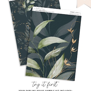May include: Two 8.5 by 12 inch samples of wallpaper printed on lux linen peel and stick. The wallpaper features a dark blue background with a repeating pattern of green leaves and gold accents. The text "darling house" and "LUX LINEN SAMPLE 8.5in x 12in" is printed on the samples.