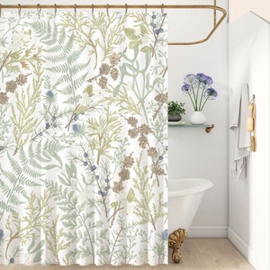 May include: White shower curtain with a botanical print featuring ferns, berries, and other foliage in shades of green, brown, and blue.
