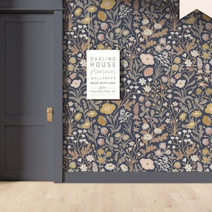 May include: A dark blue floral wallpaper with a white sign that reads "Darling House Premium Wallpaper Made with Love from Philadelphia, PA".