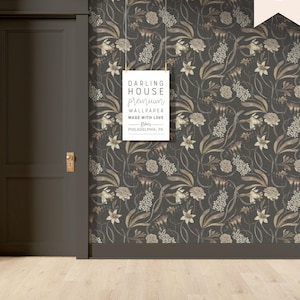 May include: A dark gray floral wallpaper with a white sign that reads "Darling House premium wallpaper made with love from Philadelphia, PA."