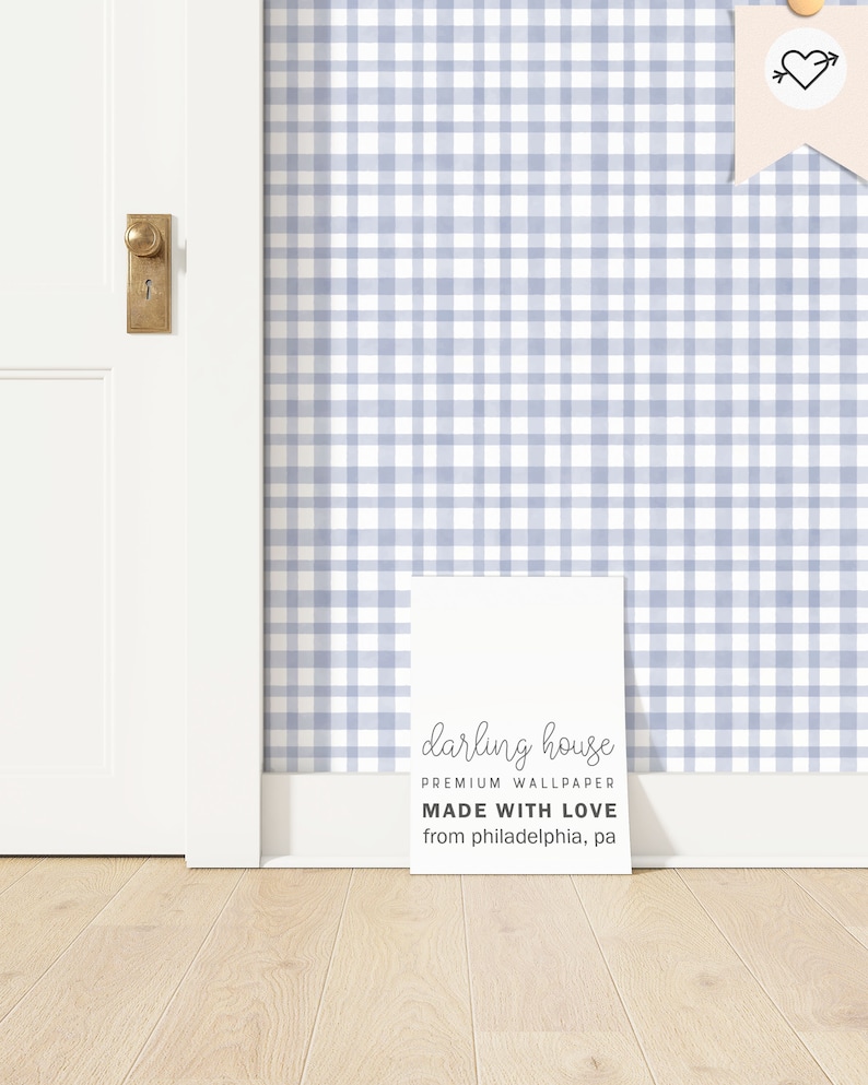 May include: A white sign with the text "darling house PREMIUM WALLPAPER MADE WITH LOVE from philadelphia, pa" on a light blue and white gingham wallpaper background.